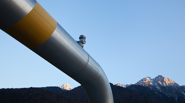 Pipe in front of mountain range (Image)